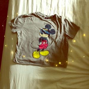 I am selling a grey Mickey Mouse crop top shirt.